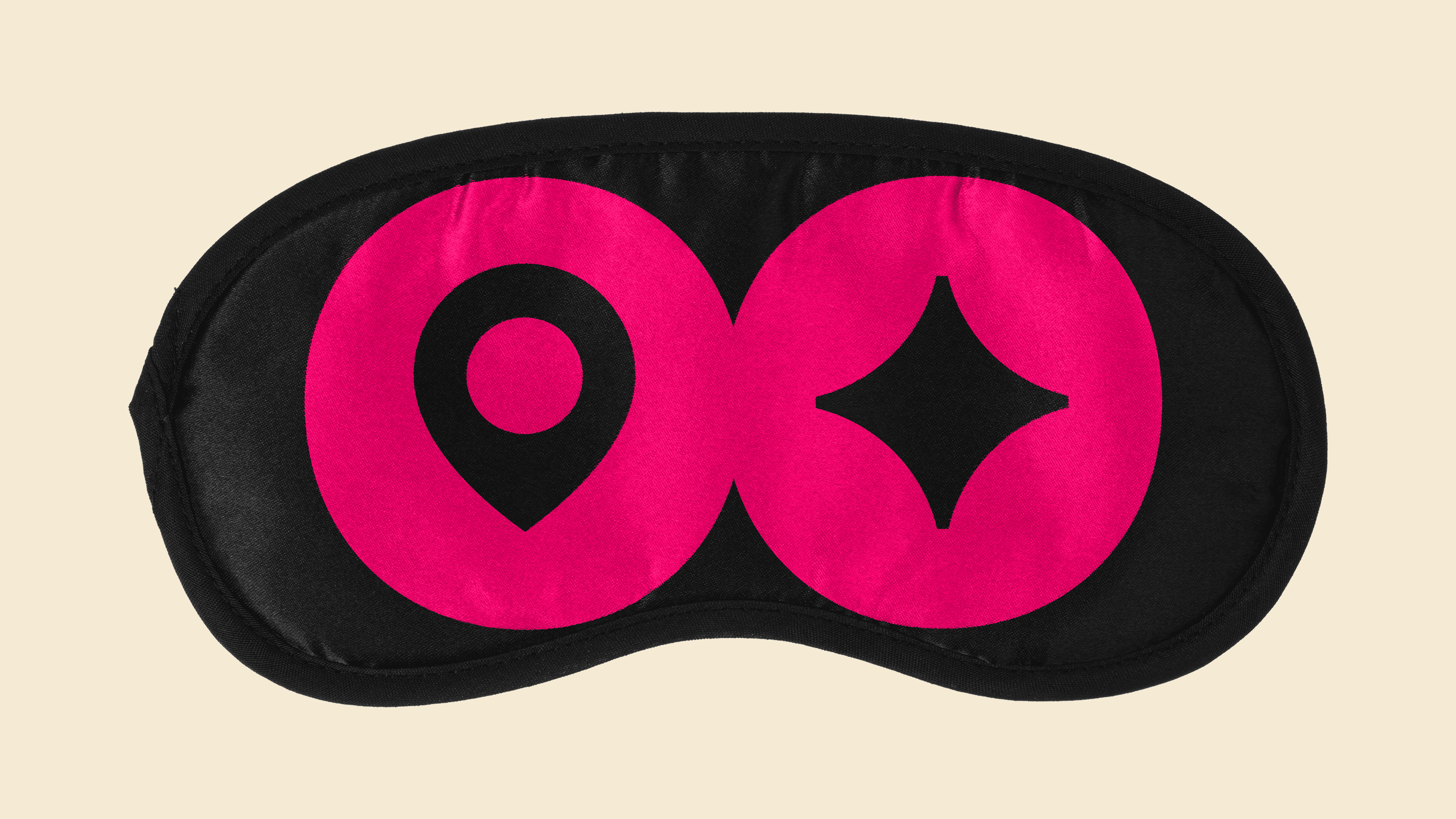 Black sleep mask printed with the pink Backdrop symbol